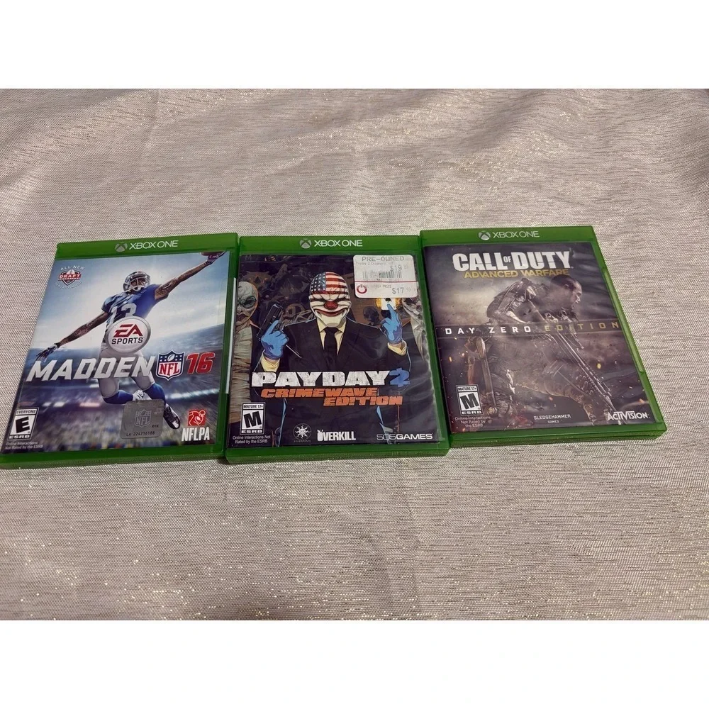 three Xbox One video games Payday, call of duty ,madden
